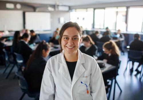 Science teacher in front of class