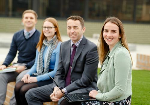 Group of teachers sitting outdoors