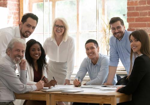 Group of diverse people working around a table