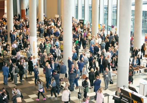 Birdseye view of conference participants congregating 