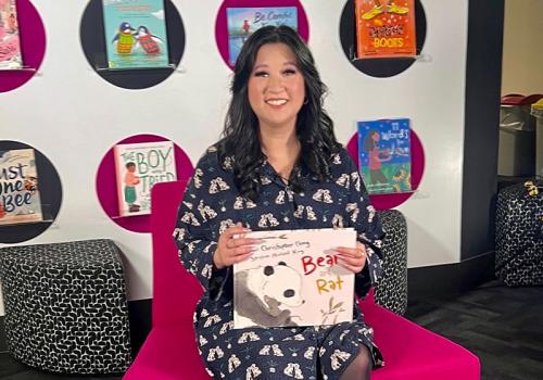 Kathy Pham holding a book for the ABC Education Story Time series
