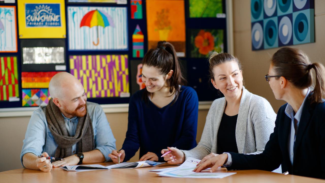 Teacher discussion around table