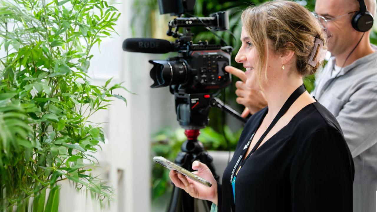 Producer and cameraman in a recording session