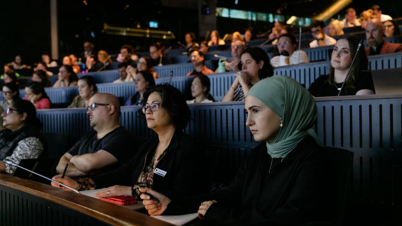 People sitting in a lecture theatre 