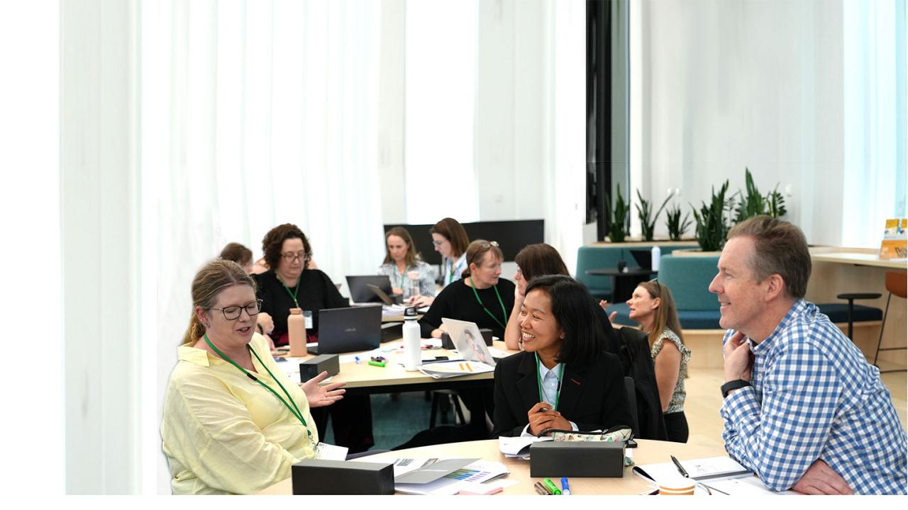 Teaching Impact Fellow in a worshop around a round table for the foundation day at the Academy