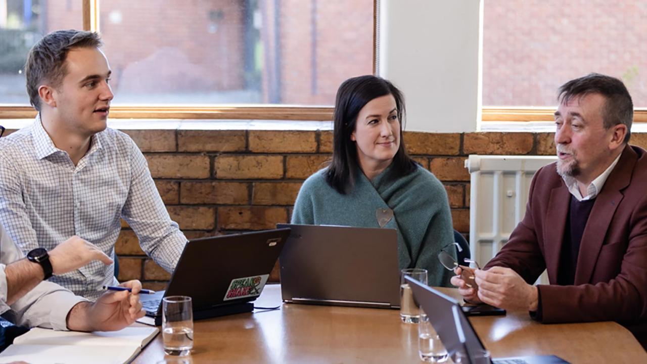 Principal mentoring teachers around the table at sandringham secondary college