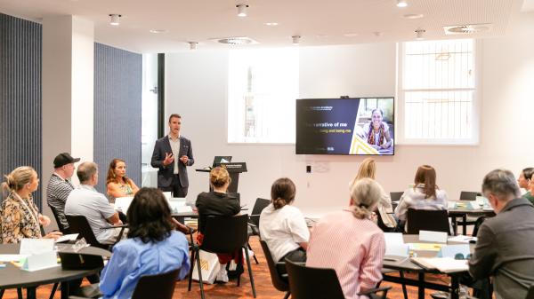Facilitator presenting at workshop at the Academy