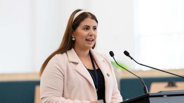 Adriana Tavares Green, Ambassador speaking at podium