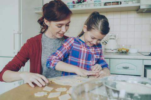 Mother and child baking showcasing a fun activity to boost maths skills