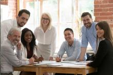 Group of diverse people working around a table