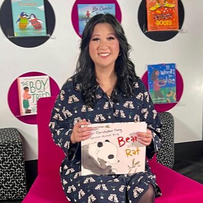 Kathy Pham holding a book for the ABC Education Story Time series