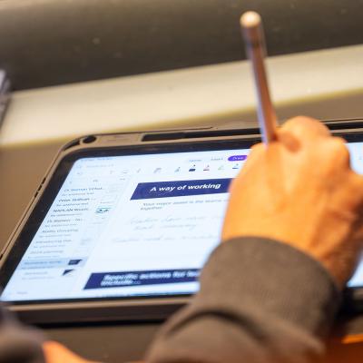 Close up of participant working on an ipad 