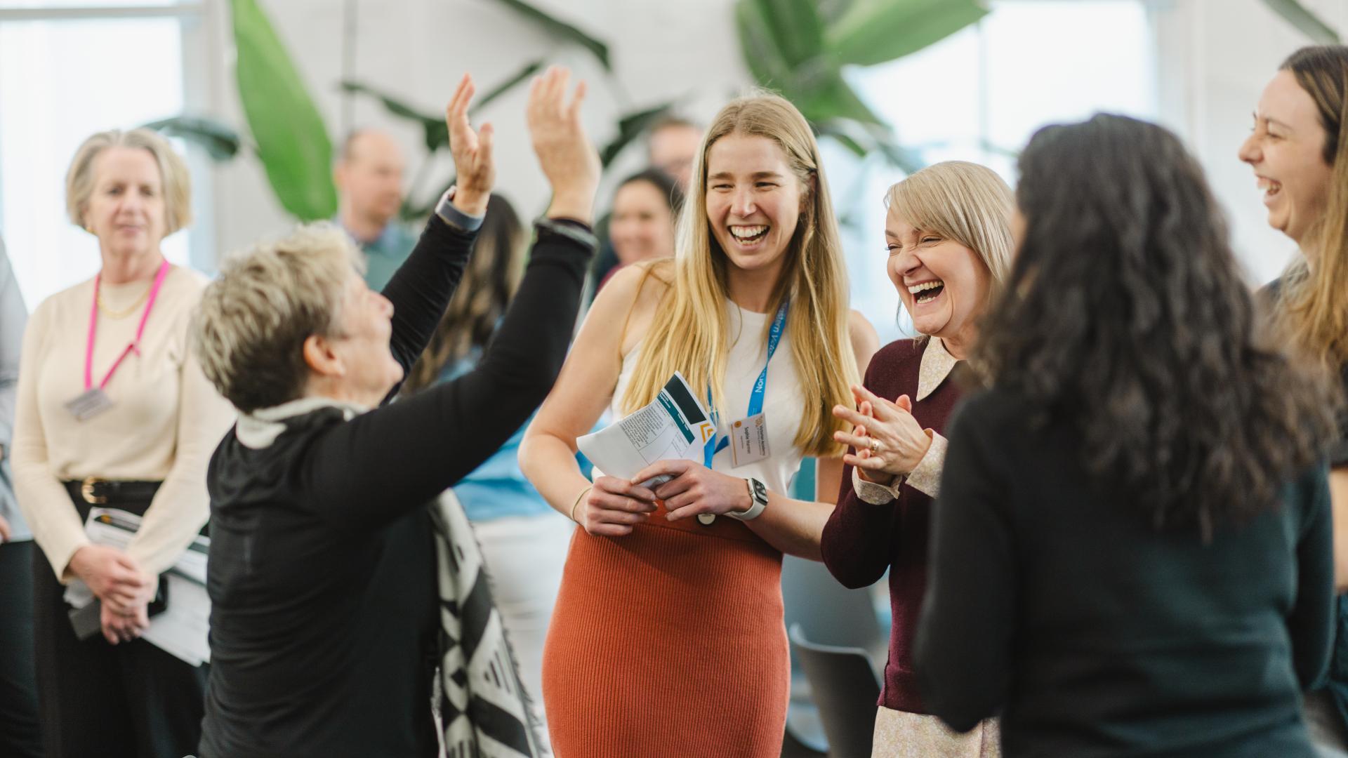 Happy Academy staff at a team event