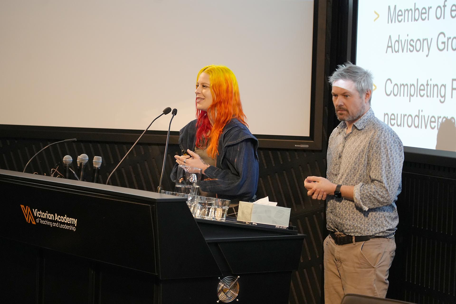 Jess Rowlings speaking at a lectern