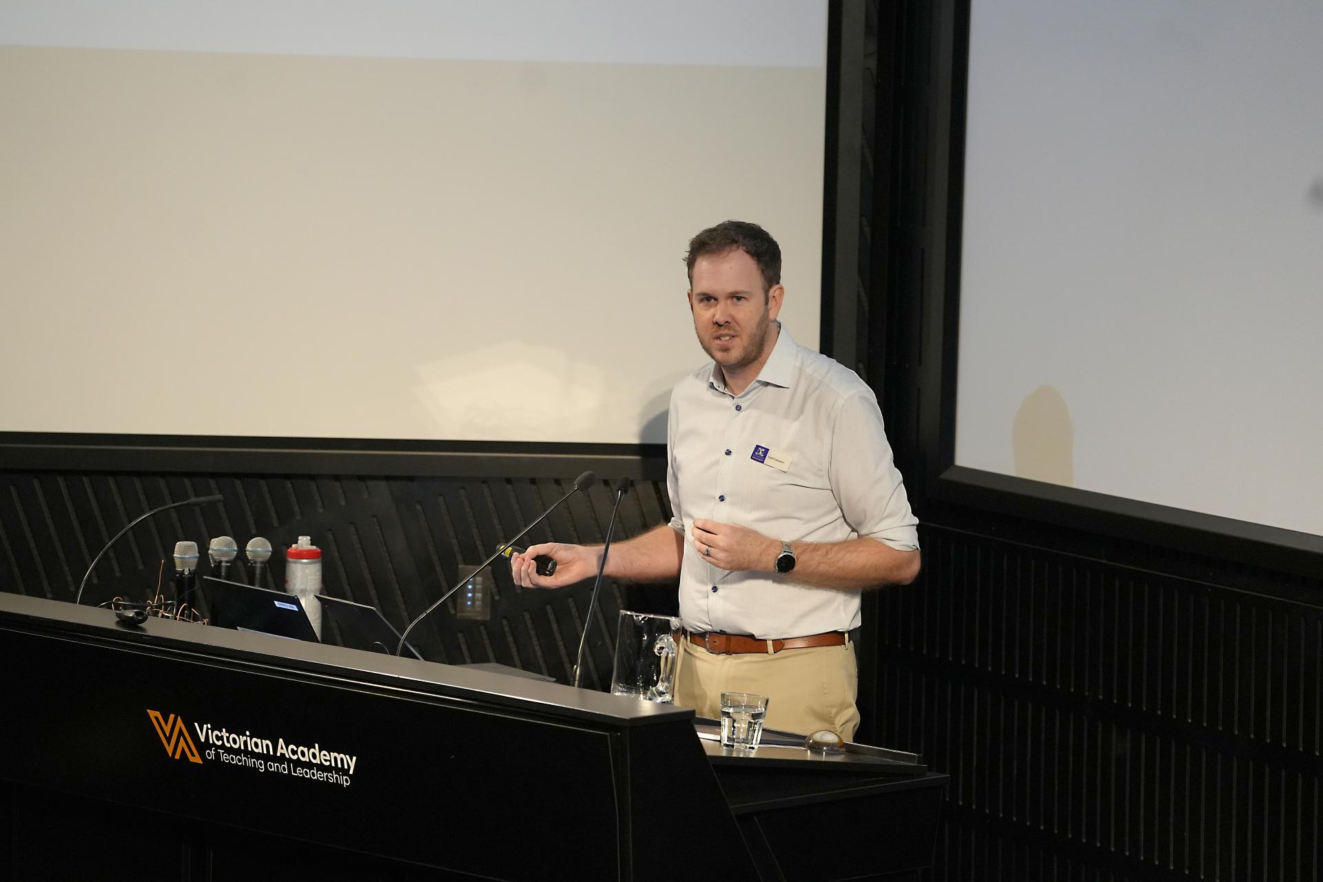 Dr Scott Cameron speaking at a lectern